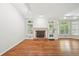 Bright living room features hardwood floors, fireplace, and natural light at 171 Riverview Trl, Roswell, GA 30075