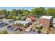 A vibrant street view featuring a mix of commercial and residential buildings in a thriving neighborhood at 171 Riverview Trl, Roswell, GA 30075