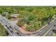 A picturesque street view featuring lush greenery and charming architecture in a desirable neighborhood at 171 Riverview Trl, Roswell, GA 30075