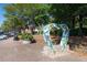 Street view of a heart-shaped sculpture, with planters in a brick paved sidewalk area at 171 Riverview Trl, Roswell, GA 30075
