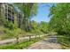 Peaceful street alongside a wooded area with a sidewalk perfect for a leisurely stroll at 171 Riverview Trl, Roswell, GA 30075