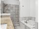The bathroom includes an undermount sink, granite counters, a soaking tub, and a tiled walk-in shower at 360 Beracah Sw Trl, Atlanta, GA 30331