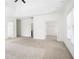 A spacious primary bedroom includes tray ceiling detail, neutral walls, carpet, and a view into the Primary bathroom and closet at 360 Beracah Sw Trl, Atlanta, GA 30331