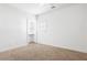 This bedroom has a closet and neutral carpet at 360 Beracah Sw Trl, Atlanta, GA 30331