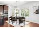Elegant dining area boasts natural light, modern furniture, and stylish decor, perfect for entertaining at 360 Beracah Sw Trl, Atlanta, GA 30331