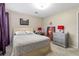 Cozy bedroom with a comfortable bed and stylish decor, including a fun '#Hustle' art piece at 4657 Tartan Ct, Union City, GA 30291