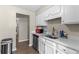Bright kitchen boasts stainless steel appliances, white cabinets, and laminate countertops at 4657 Tartan Ct, Union City, GA 30291