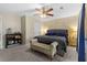 Comfortable main bedroom with neutral walls, ceiling fan, and carpeted floors at 4657 Tartan Ct, Union City, GA 30291