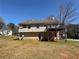 Spacious backyard featuring a deck and a two-story house, ideal for outdoor activities and gatherings at 8302 N Sterling Lakes Dr, Covington, GA 30014