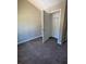 Cozy bedroom with plush carpet and a closet, offering comfort and storage at 8302 N Sterling Lakes Dr, Covington, GA 30014