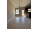 A well lit dining area with an overhead chandelier and access to the exterior patio at 8302 N Sterling Lakes Dr, Covington, GA 30014