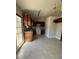 Functional kitchen with white appliances, wooden cabinetry, and access to the patio at 8302 N Sterling Lakes Dr, Covington, GA 30014