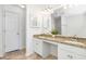 Bright bathroom with granite countertops, double sinks, and a large mirror at 1688 Jackson Sq, Atlanta, GA 30318