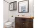 Well-lit bathroom featuring a modern vanity, toilet, and medicine cabinet at 1688 Jackson Sq, Atlanta, GA 30318