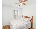 A cozy bedroom featuring a ceiling fan and a window with natural light at 1688 Jackson Sq, Atlanta, GA 30318