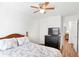 Well-lit bedroom features a ceiling fan, and access to the hallway and closet at 1688 Jackson Sq, Atlanta, GA 30318