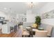 Charming eat-in area with hardwood flooring connecting the kitchen and living spaces at 1688 Jackson Sq, Atlanta, GA 30318