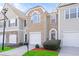 Attractive townhome with brick facade, attached garage, and tidy front lawn at 1688 Jackson Sq, Atlanta, GA 30318