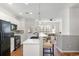 Modern kitchen with stainless appliances, quartz counters, and breakfast bar at 1688 Jackson Sq, Atlanta, GA 30318