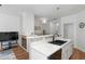 A contemporary kitchen featuring a black sink, quartz countertop, and stainless steel appliances at 1688 Jackson Sq, Atlanta, GA 30318