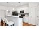 Efficient kitchen featuring a breakfast bar with a view to the living room at 1688 Jackson Sq, Atlanta, GA 30318