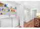 Well-organized laundry room with washer, dryer, shelving, and ample storage space at 1688 Jackson Sq, Atlanta, GA 30318