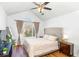 Bright and airy bedroom with hardwood floors, a large window, and stylish furniture at 1688 Jackson Sq, Atlanta, GA 30318
