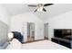 A bright main bedroom boasts vaulted ceilings and modern furniture at 1688 Jackson Sq, Atlanta, GA 30318