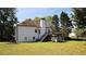 View of the backyard with a deck, grill, and a white shed for storage at 1770 Bethany Spring, Cumming, GA 30041