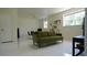 Finished basement with polished floor, lounge area, and natural light at 1770 Bethany Spring, Cumming, GA 30041
