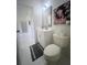 This half-bathroom features a toilet, a stylish vanity, and fashionable decorations at 1770 Bethany Spring, Cumming, GA 30041