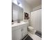 This bathroom is equipped with a shower, a modern vanity, and a gray accent rug at 1770 Bethany Spring, Cumming, GA 30041