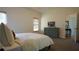 Bright bedroom with neutral colors, and a view through the open door to another room at 1770 Bethany Spring, Cumming, GA 30041