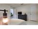 This bedroom features neutral walls, an elegant lamp, and a TV atop a dresser at 1770 Bethany Spring, Cumming, GA 30041