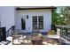 This cozy deck is furnished with chairs and a fire pit, perfect for outdoor relaxation at 1770 Bethany Spring, Cumming, GA 30041