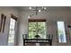 Bright dining area with a glass table, seating for six, modern light, and natural light at 1770 Bethany Spring, Cumming, GA 30041