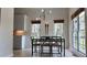 Bright breakfast nook with modern light fixture, table, and views from windows at 1770 Bethany Spring, Cumming, GA 30041