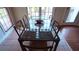 Dining room with a glass table, seating for six, and lots of natural light at 1770 Bethany Spring, Cumming, GA 30041