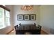 Light-filled dining room features hardwood floors, a stylish chandelier, and space for a large dining table at 1770 Bethany Spring, Cumming, GA 30041