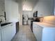 Modern kitchen featuring white cabinets, stainless steel appliances, and quartz countertops at 1770 Bethany Spring, Cumming, GA 30041