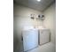 A brightly lit laundry room features both a washer and a dryer at 1770 Bethany Spring, Cumming, GA 30041
