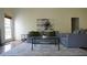 Bright living room featuring hardwood floors, a fireplace, and comfortable sofas with an art piece at 1770 Bethany Spring, Cumming, GA 30041