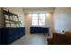 A bright office offers a desk, blue storage cabinet, an accent chair, and recessed lights at 1770 Bethany Spring, Cumming, GA 30041