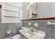 Bathroom with a commode, basin, and tiled walls at 1911 Lavista Ne Rd, Atlanta, GA 30329