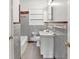 Bathroom with a tub, commode, and tiled walls at 1911 Lavista Ne Rd, Atlanta, GA 30329