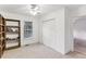 Bright bedroom with built-in bookcase, closet, neutral carpet, and window at 1911 Lavista Ne Rd, Atlanta, GA 30329