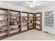 Bedroom featuring custom, built-in bookcases along the walls and a ceiling fan at 1911 Lavista Ne Rd, Atlanta, GA 30329