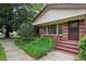 Charming brick home with a covered front porch and beautiful landscaping at 1911 Lavista Ne Rd, Atlanta, GA 30329