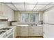 The eat-in kitchen features standard cabinetry, appliances, and eat-in nook at 1911 Lavista Ne Rd, Atlanta, GA 30329