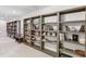 Spacious living room with custom, built-in bookcases throughout and neutral carpet at 1911 Lavista Ne Rd, Atlanta, GA 30329